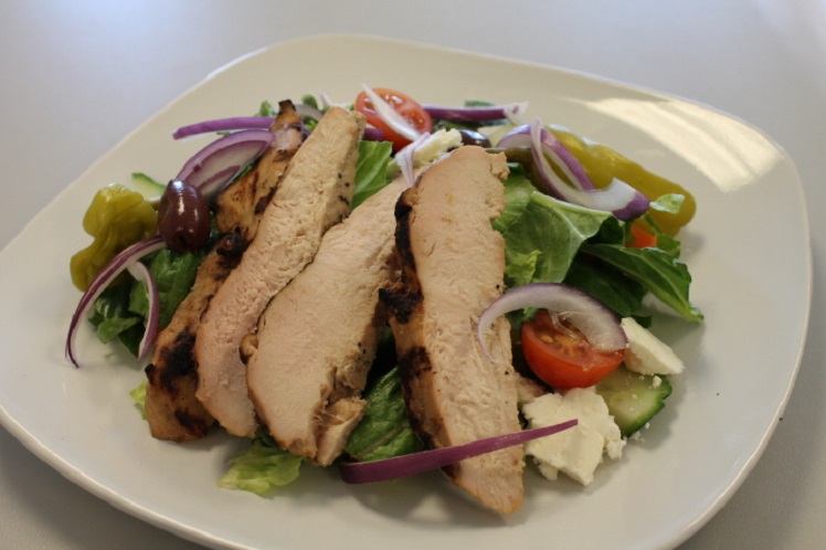 Greek salad with lemon oregano grilled chicken, mixed greens, tomato, cucumber, feta cheese and kalamata olives.