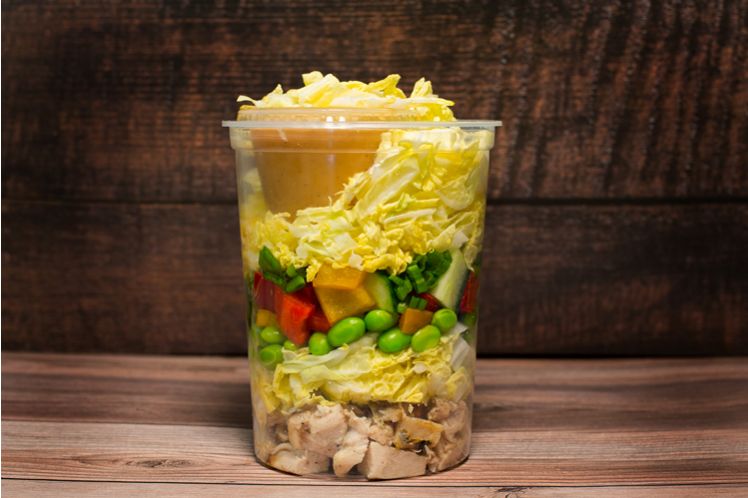 Thai crunch chicken salad with cabbage, edamame, peanuts and peanut sesame dressing.