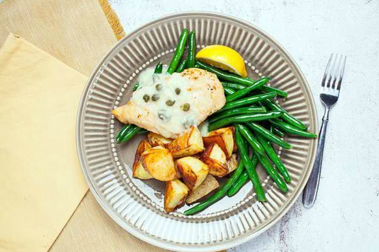 Chicken piccata in lemon caper sauce with oven roasted potatoes and green beans.