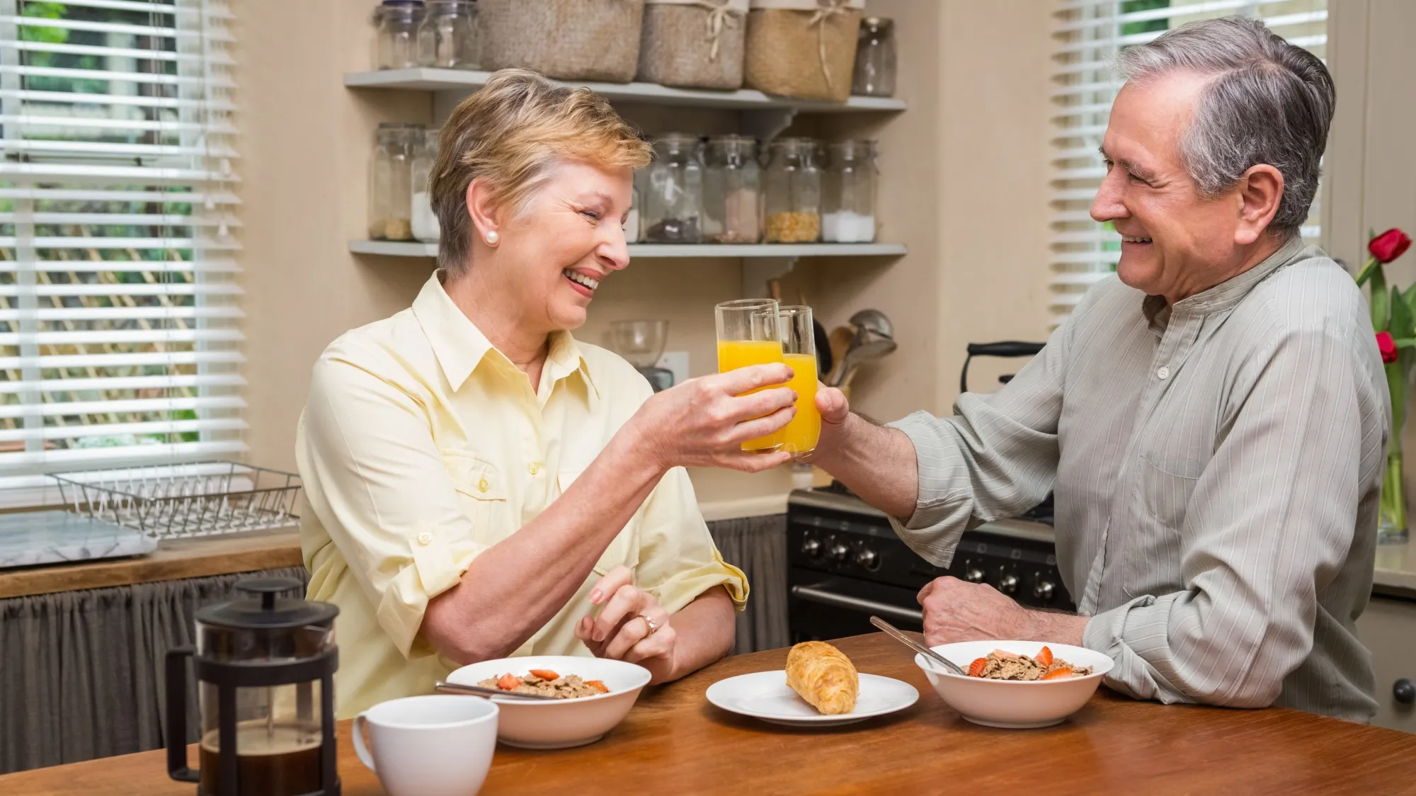 elderly couple enjoying nutritional drink