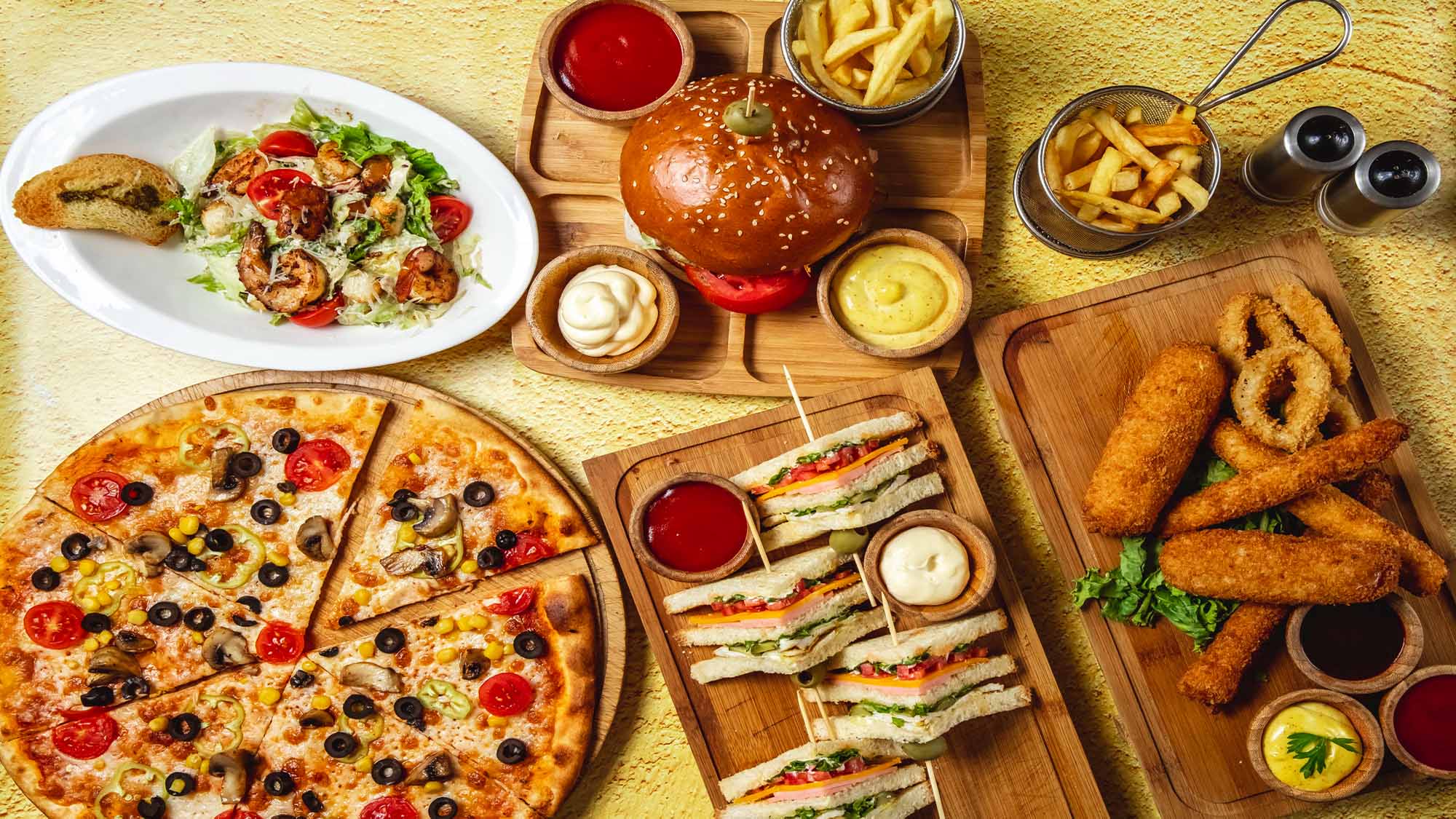 fast-food-mix-french-fries-pizza-mozzarella-sticks-club-sandwich-hamburger-mushroom