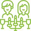 Icon of a couple dining with wine glasses and candles, indicating the option to order a Thanksgiving meal for two from Meal Village